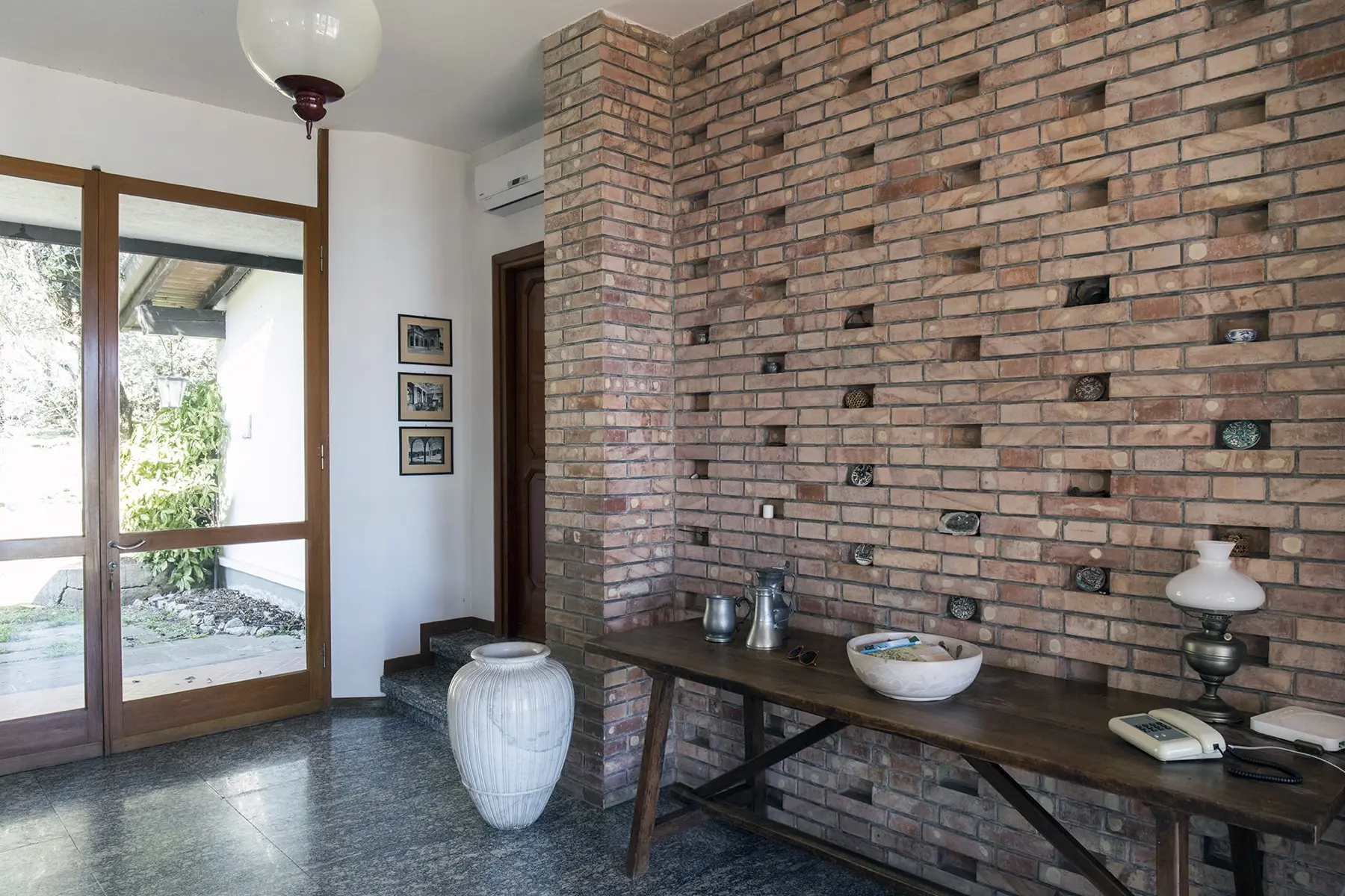 Entrance hall with brick wall